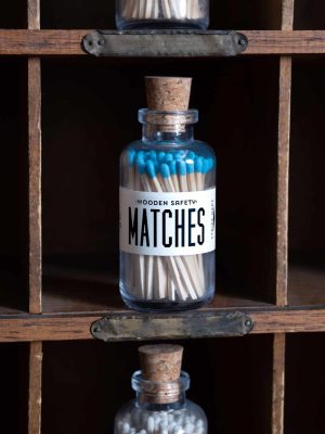 Mini Apothecary Vintage Aqua Matches housed in a vintage apothecary-style glass jar with a cork top. A practical and stylish accessory for lighting candles, incense, or fireplaces.