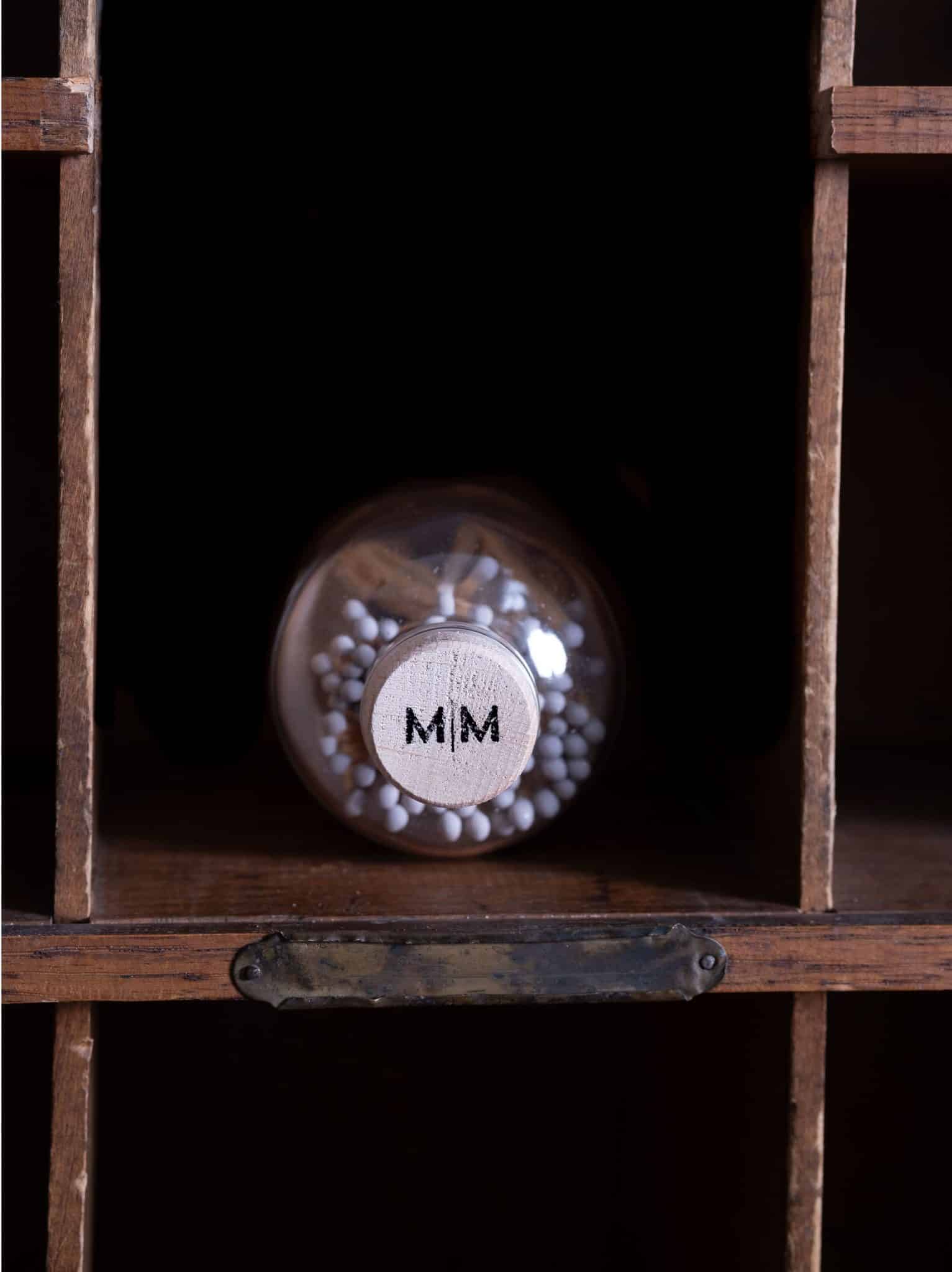Vintage Apothecary Gray Matches in a glass jar with a wooden cork top and vintage-style label.