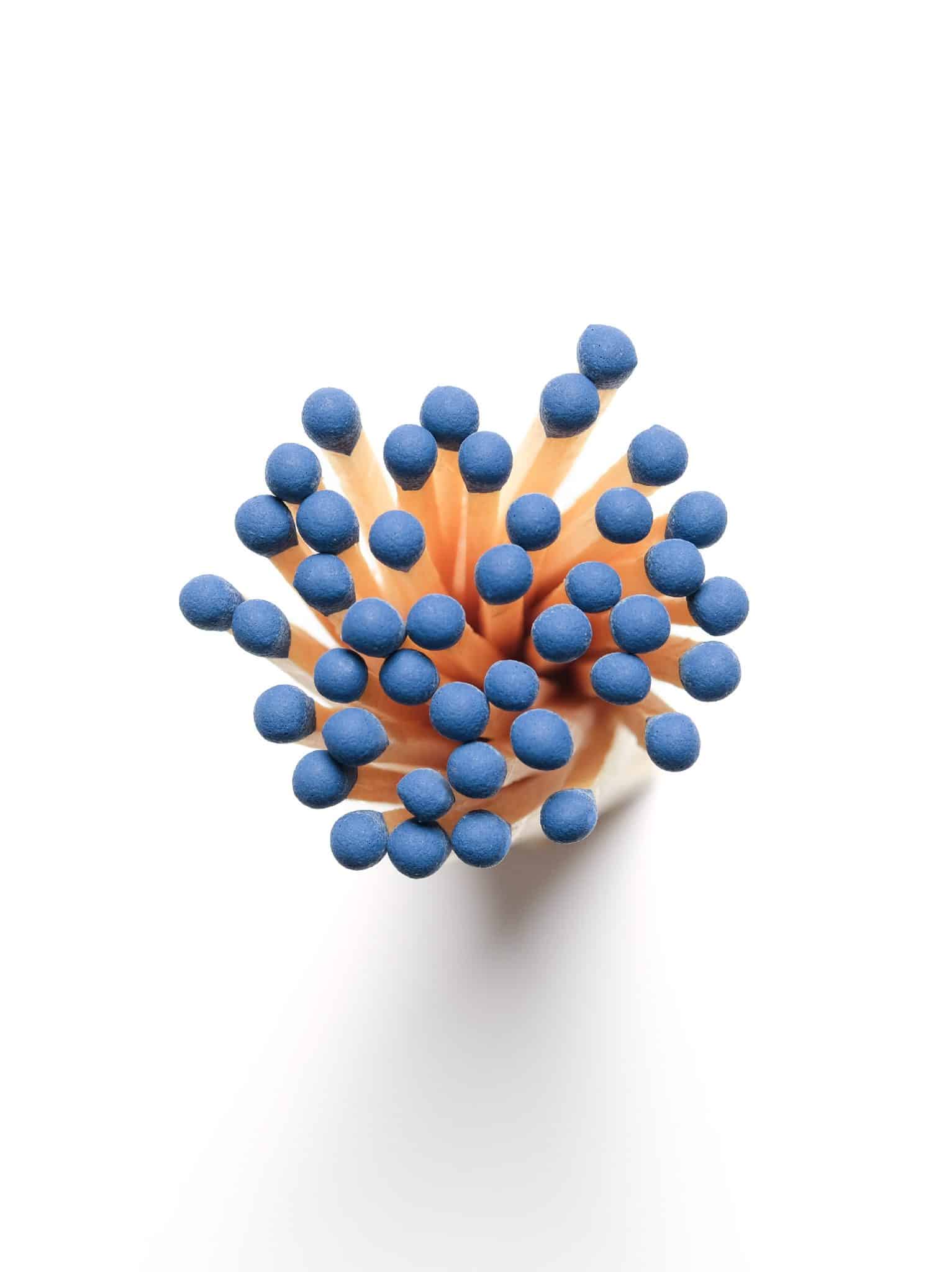 Overhead image of Made Market matchsticks with blue colored tips