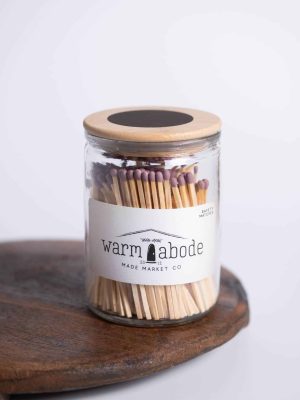 Mauve-tipped matches shown in signature Warm Abode glass jar