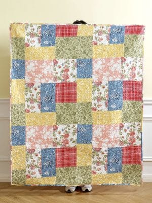 Full view of the Floral Quilt Farmhouse Throw Blanket showing its colorful patchwork pattern
