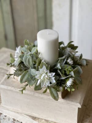 White Cottage Blooms Candle Ring with layered blossoms and greenery styled with a pillar candle