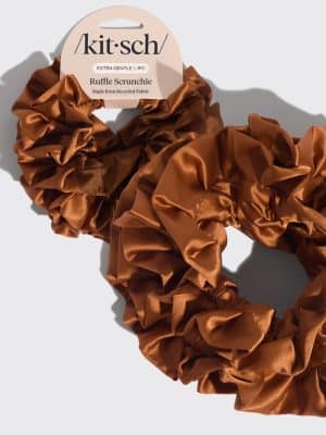 Camel-colored ruffle scrunchie made from soft recycled fabric displayed on a neutral background.