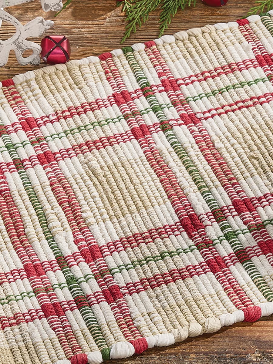 Close-up of the Cozy Christmas Chindi Table Runner showing the red, green, and cream plaid chindi weave.