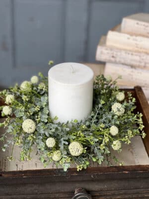 White Garden Allium Candle Ring styled around a white pillar candle with mixed foliage.