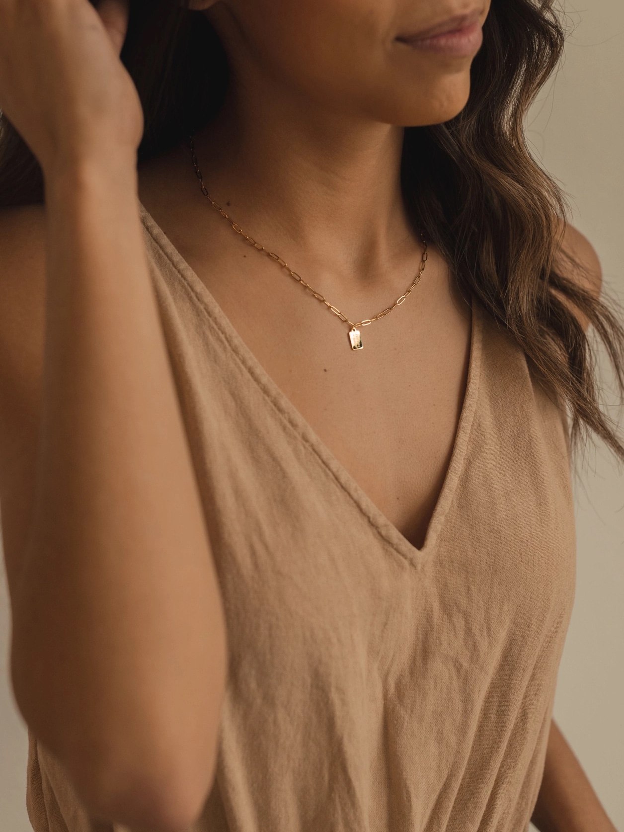 Woman wearing Hope + Future Mini Tag Necklace on paperclip chain