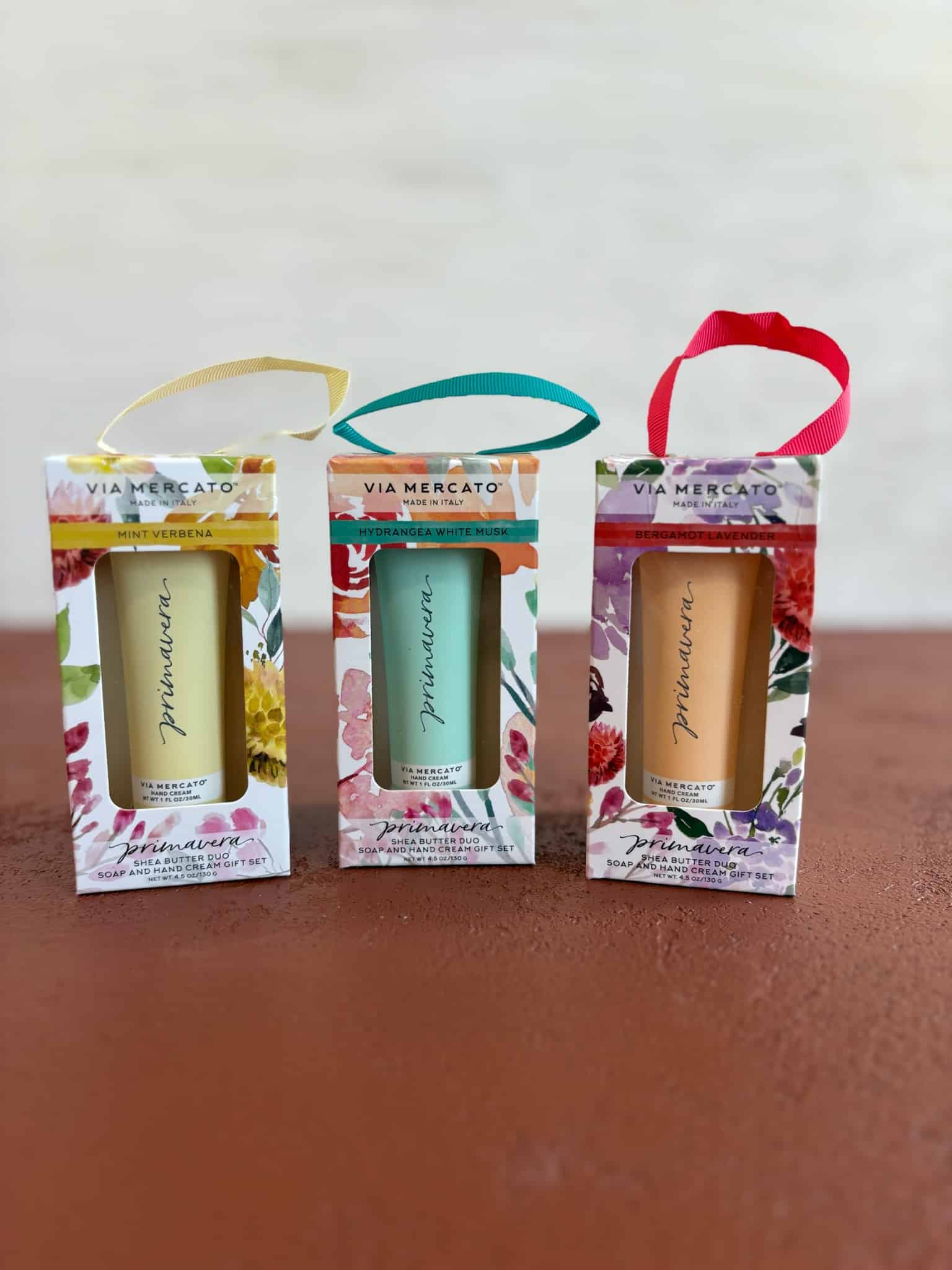 Full set of Via Mercato boxed gift duos including Mint Verbena (yellow), Bergamot Lavender (orange), and Hydrangea White Musk (green).