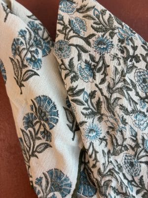 Close-up of Juniper Kitchen Towel showing botanical block print in muted blue and charcoal on soft cotton gauze.