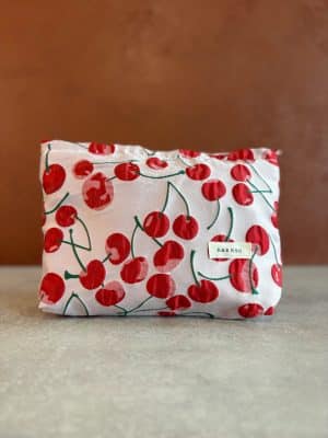 Front view of the Red Cherry Makeup Bag showing full cherry print design with zipper along the top.