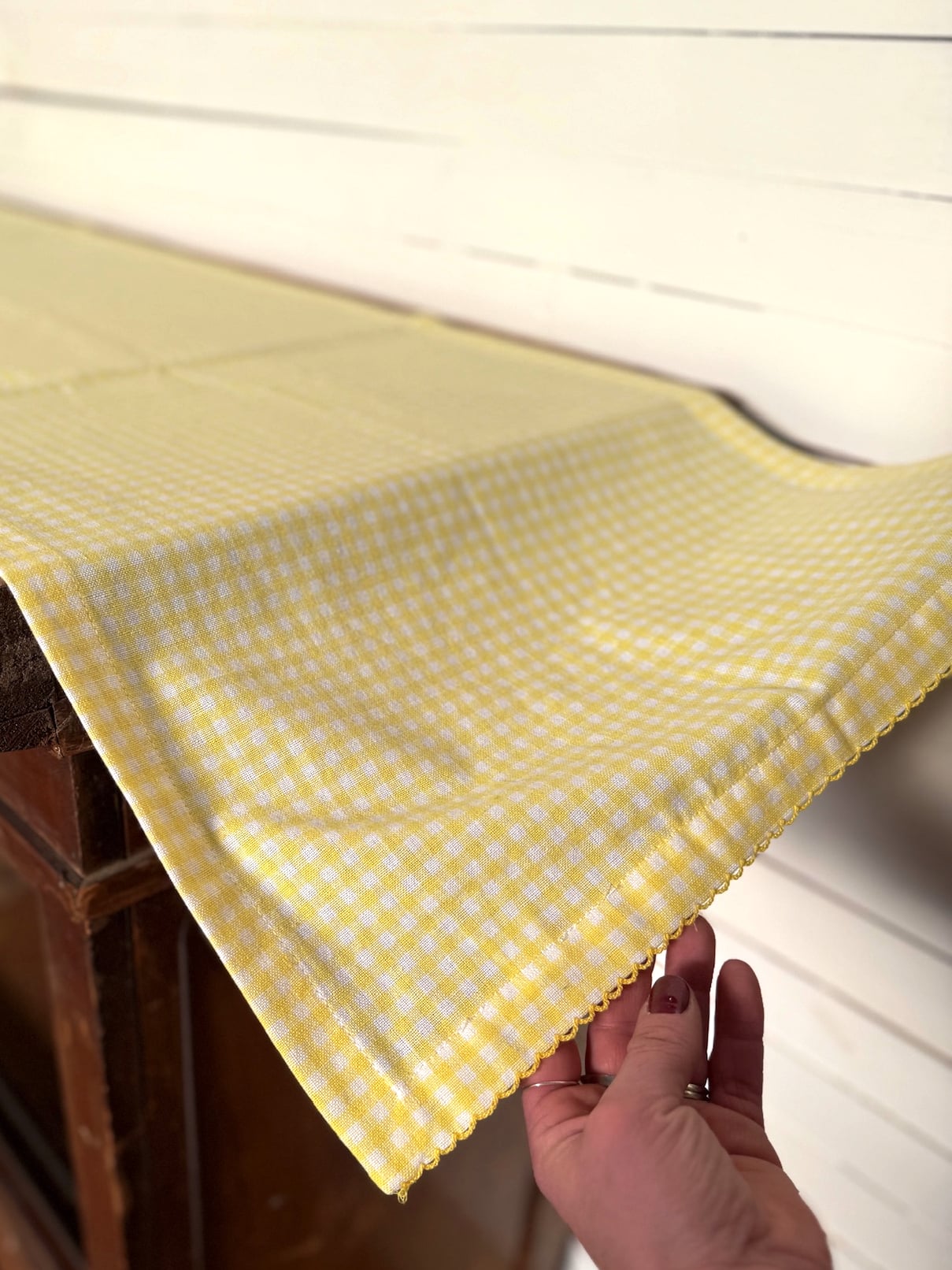 Yellow Cotton Gingham Table Runner Draped Over Table Edge