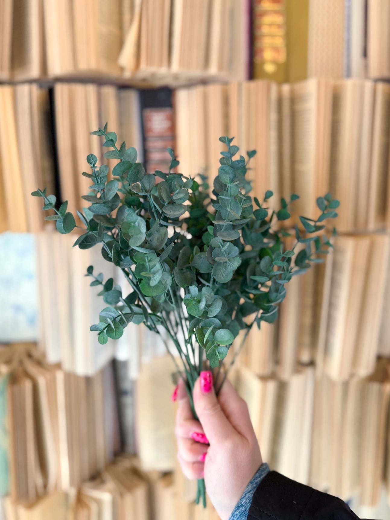 Bundle of faux eucalyptus leaf sprays featuring layered dusty green leaves for a full, natural arrangement.