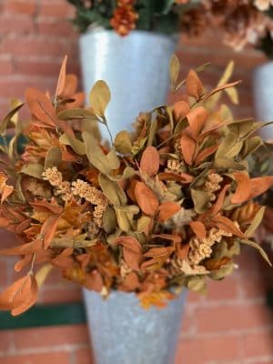 Close-up of the Maple & Walking Fern Pick showing warm orange maple leaves, gold ferns, and soft brown pods.
