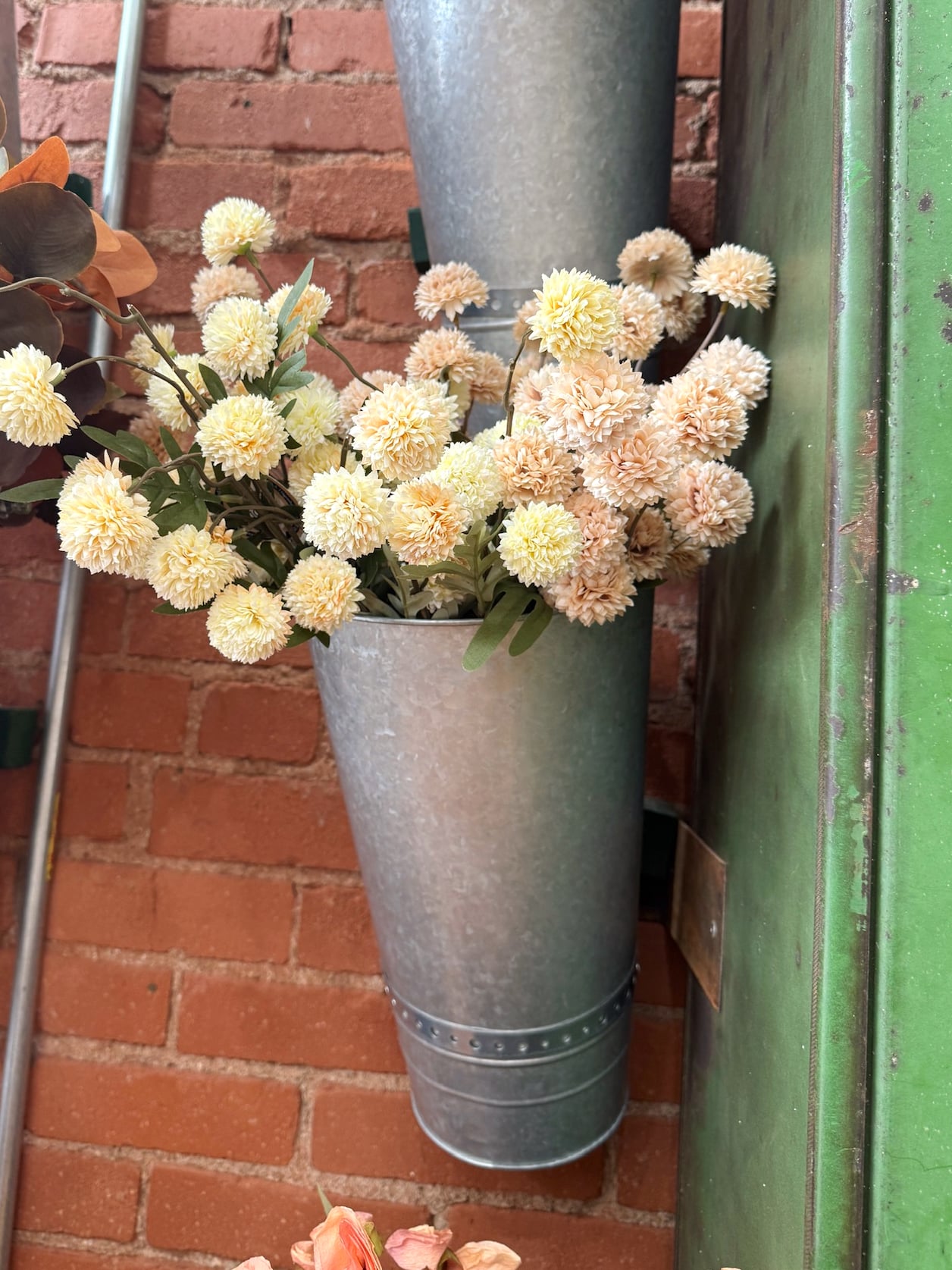 Cream and beige faux onion spray stems in soft round blooms