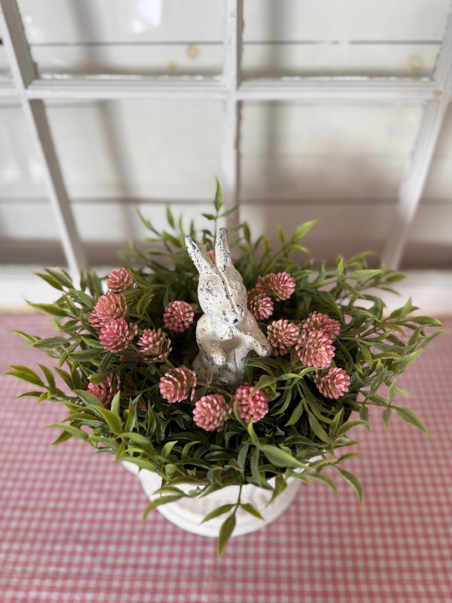 White Metal Pedestal Bowl Styled With Pink Thimble Bud Candle Ring and Distressed Bunny Figurine
