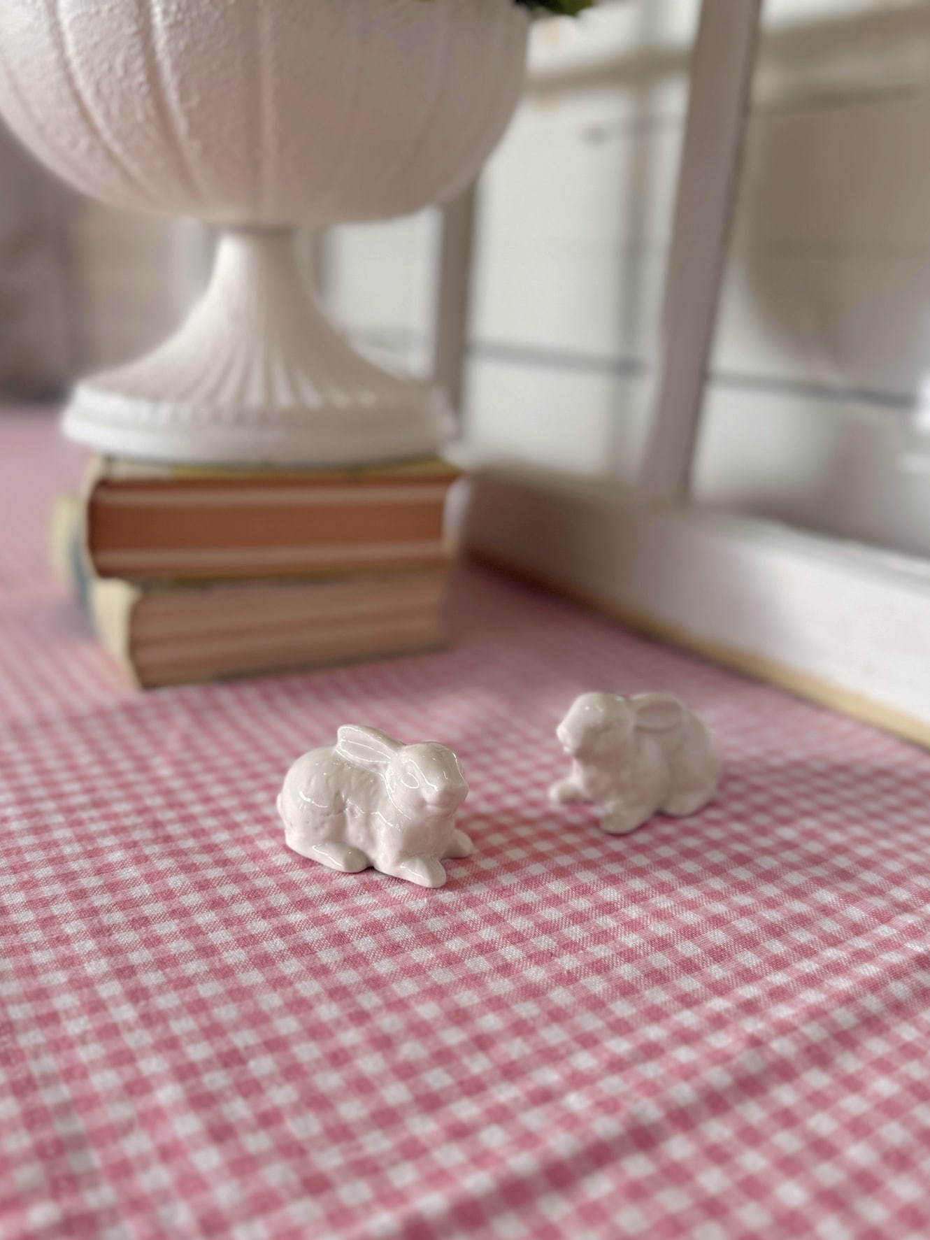 Petite White Ceramic Bunny Decor Styled With Books and Pedestal