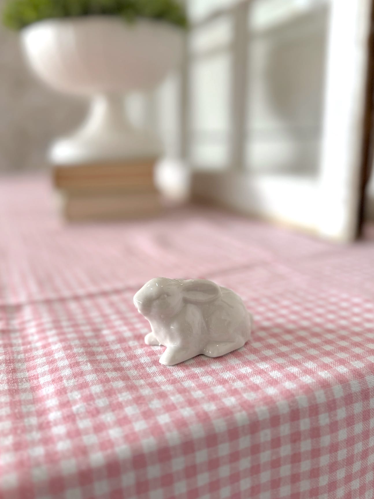 White Ceramic Mini Bunny Figurine Styled on Pink Gingham Tablecloth
