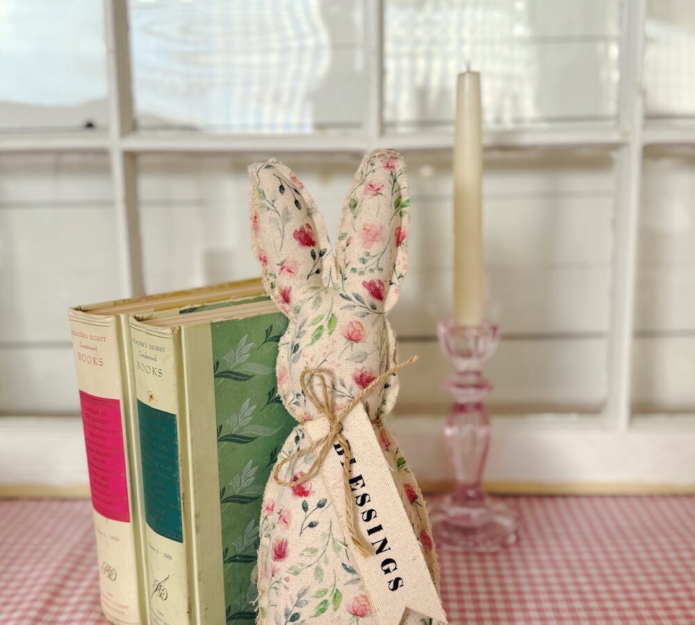 be-made-hays-ks-floral-fabric-bunny-decor Floral Plush Easter Bunny Standing Next to Decorative Books