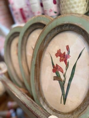 Oval Wood Framed Flower Wall Decor No. 5 with red floral botanical print in distressed green and natural wood frame.
