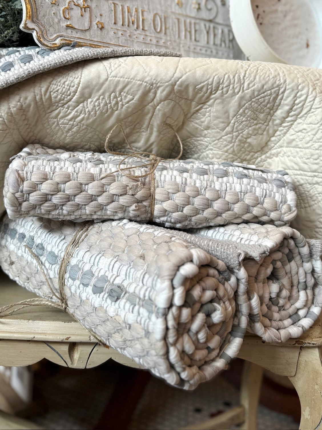 All Is Calm Chindi Table Runner shown rolled in a neutral, textured display.