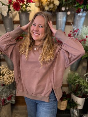 Woman wearing the brown Crewneck Oversized Side Slit sweatshirt, showing the relaxed fit and balloon sleeves.