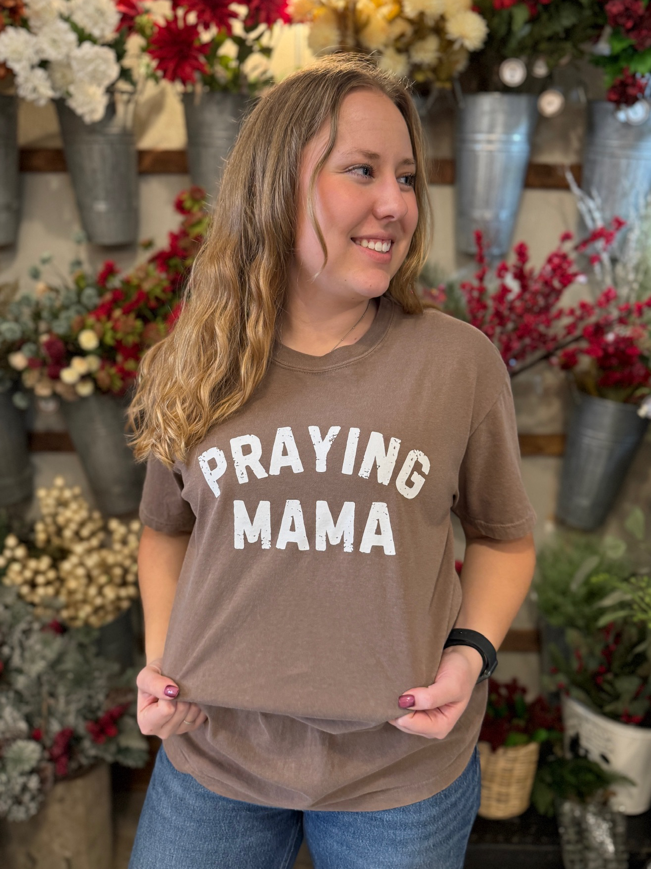 be-made-hays-ks-comfort-colors-praying-mama-shirt-brown Close-up of the Praying Mama Comfort Colors tee in espresso brown with white text.
