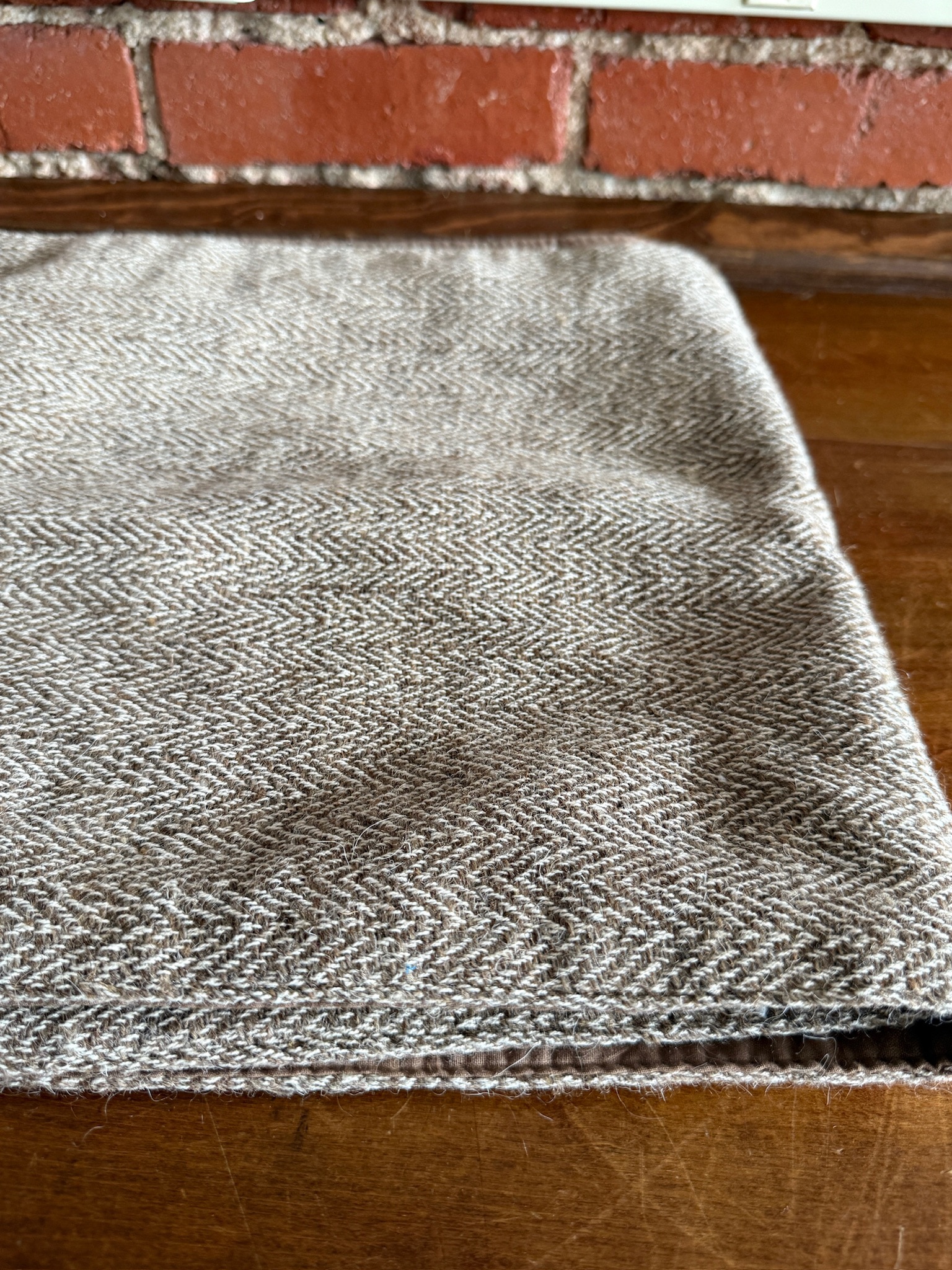 Folded Brown & Cream Wool Table Runner showcasing chevron tweed weave in neutral brown and cream.