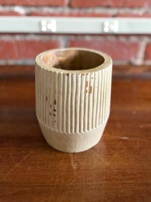 Front view of Hand Carved Striped Mango Wood Planter featuring vertical stripe pattern and warm wood finish.