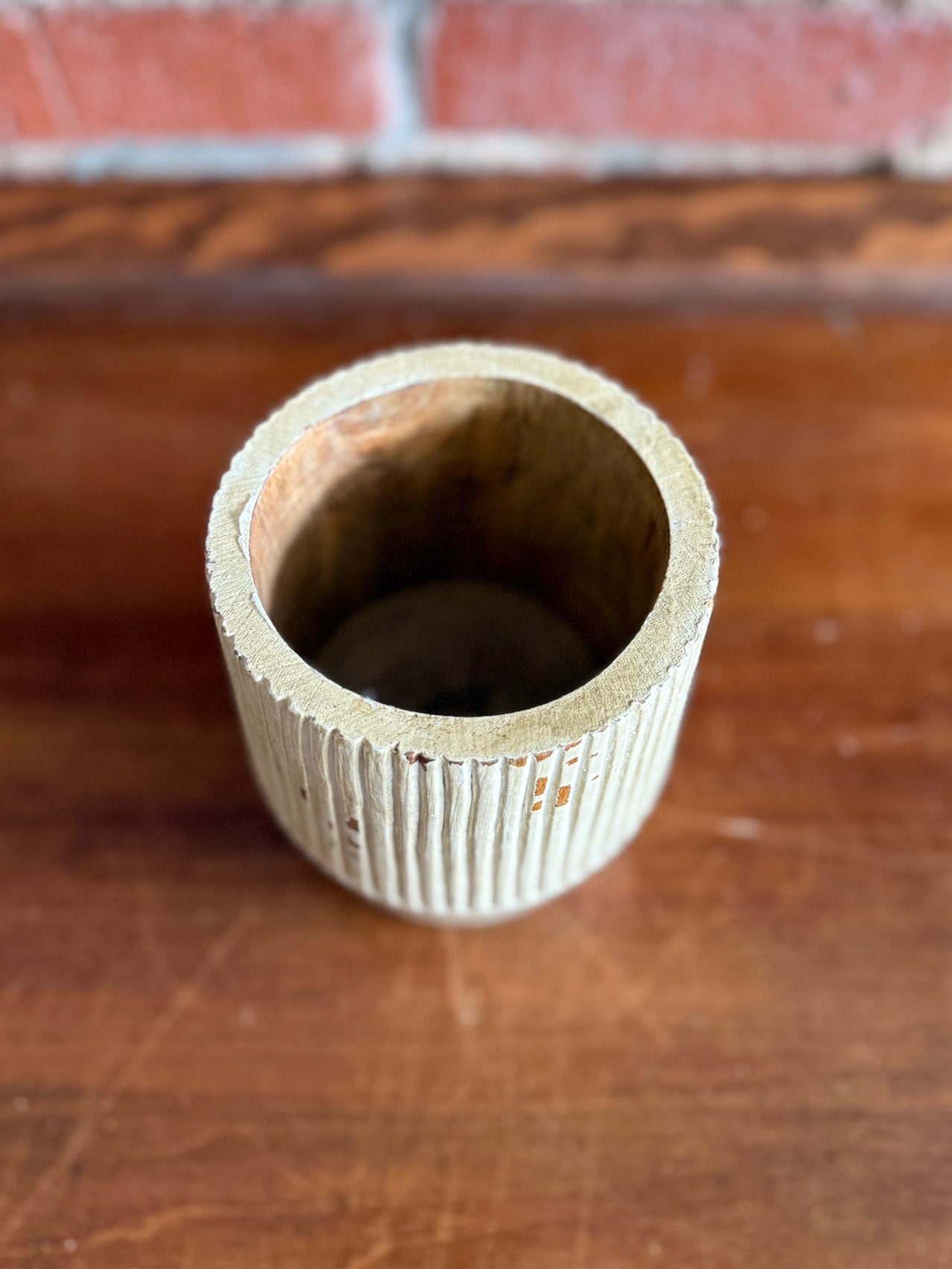 Hand Carved Striped Mango Wood Planter with natural finish and vertical carved texture, top view.