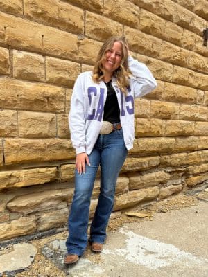Front view of The Cats Oversized Ash Gray Cardigan featuring open-front fit, raw edge details, and oversized purple “CATS” lettering.