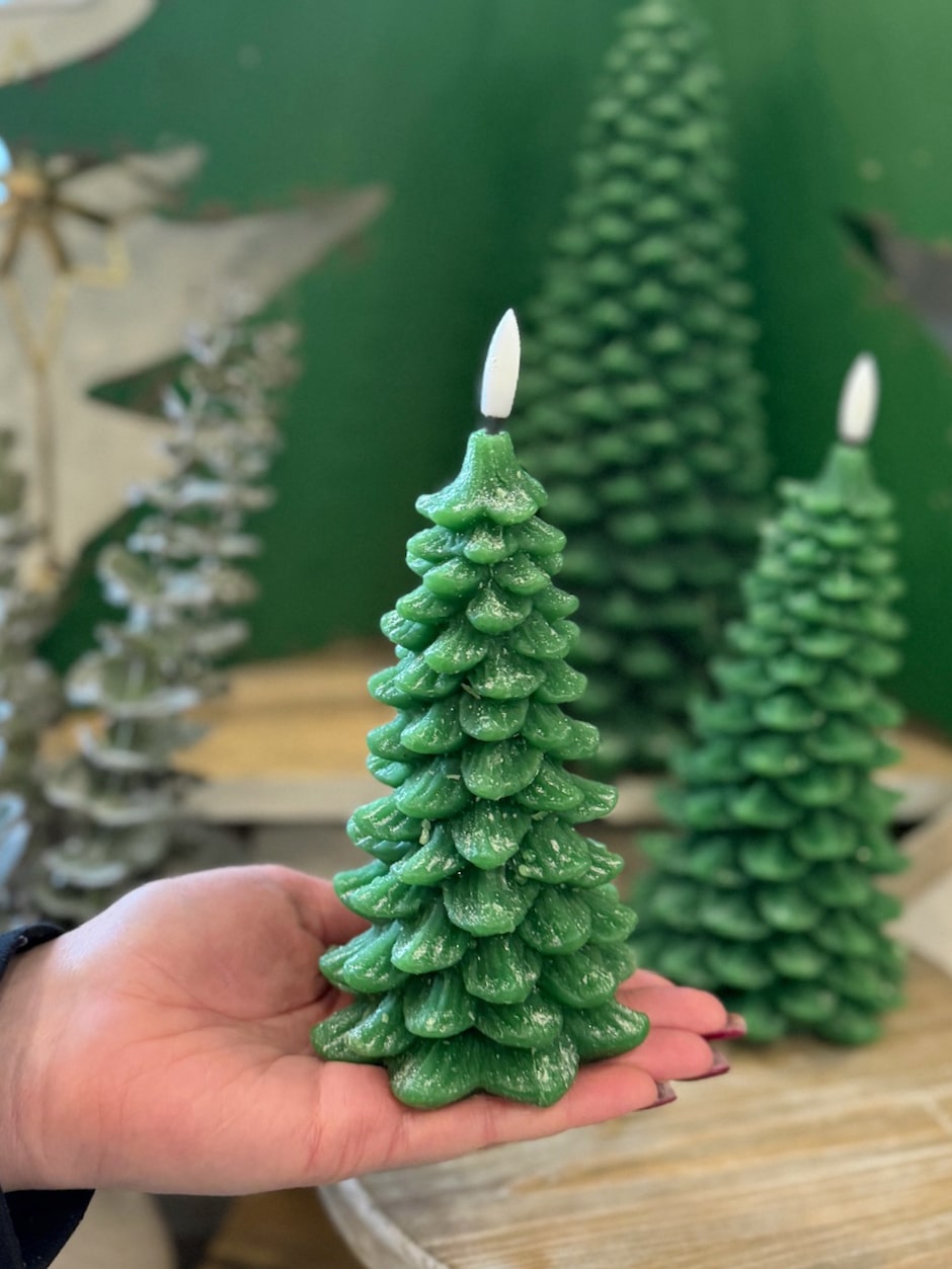 Close-up of the layered branch detail on the green 3D flameless tree candle.