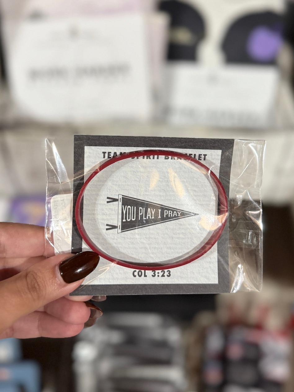 Maroon You Play I Pray silicone bracelet packaged on display card.