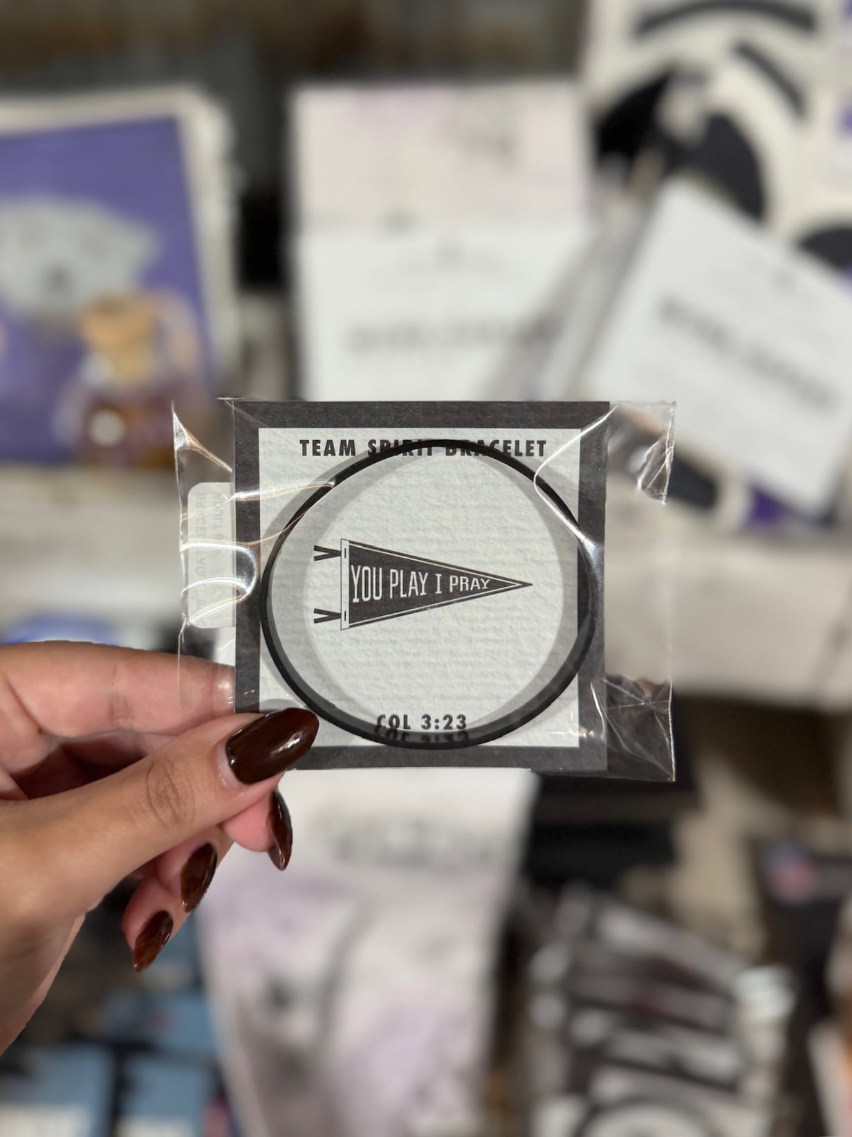 Packaged “You Play I Pray” black silicone bracelet displayed in retail packaging.