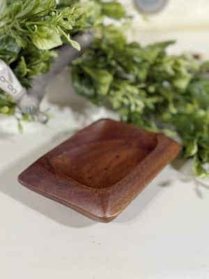 Acacia wood soap dish angled to show depth and carved interior.