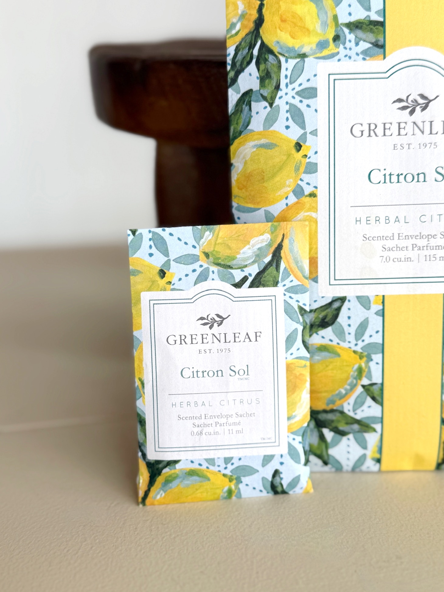 A small and large Greenleaf Citron Sol sachet displayed together on a neutral surface.