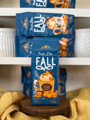 Blue fall-themed coffee bag featuring pumpkin spice and caramel swirl flavor.