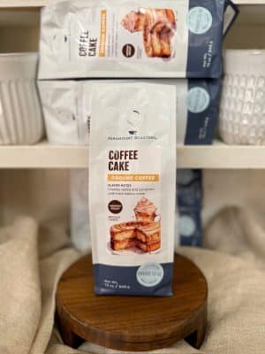 Coffee Cake ground coffee packaging by Paramount Roasters displayed on shelf.