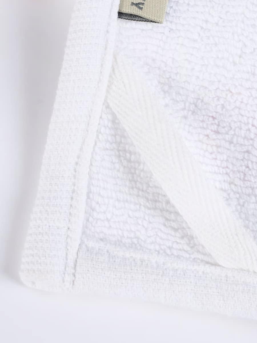 Close-up of white terrycloth backing on the Iced Sugar Cookies Kitchen Towel.