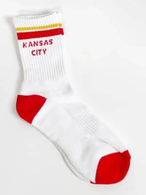 White Kansas City crew sock with red heel and toe, gold-and-red cuff stripes, and Kansas City lettering