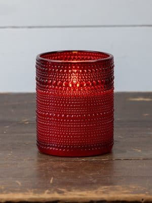 Festive red flameless candle in dotted glass design with 3D flame.