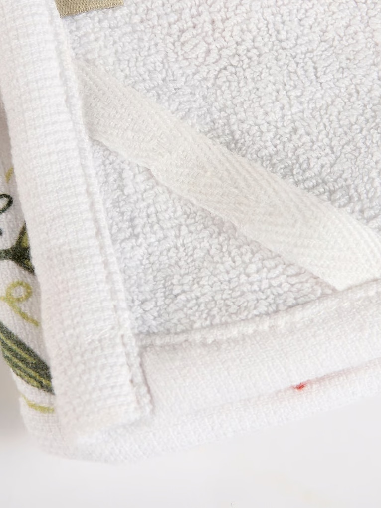 Nature-inspired floral dish towel with corner loop for hanging and easy use.