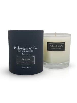 Autumn Pickwick Candle in glass vessel with black gift box, featuring baked apple, orange peel, cinnamon, clove, nutmeg, and vanilla fragrance.