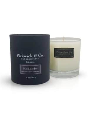 Black Amber Pickwick Candle with black box and glass vessel, 10 oz soy candle in Baltic amber, tonka vanilla, and plum scent.
