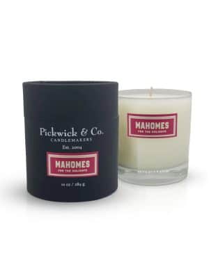 Mahomes for the Holidays Pickwick Candle in glass vessel with black gift box, featuring balsam, leather, and amber fragrance.