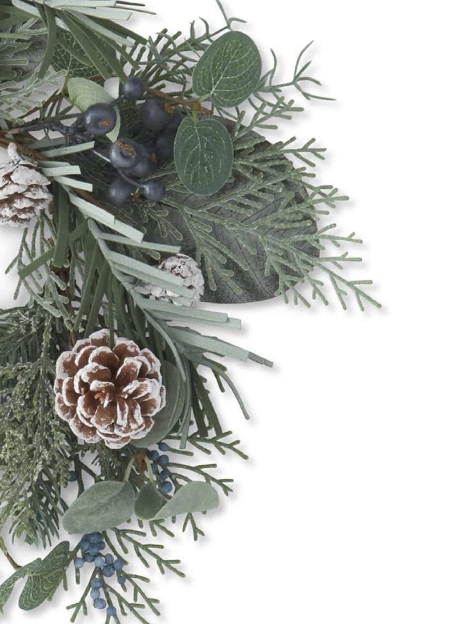 Close-up view of the Frosted Cedar and Eucalyptus Wreath with Blue Berry showing frosted greenery, pinecones, and blue berries.