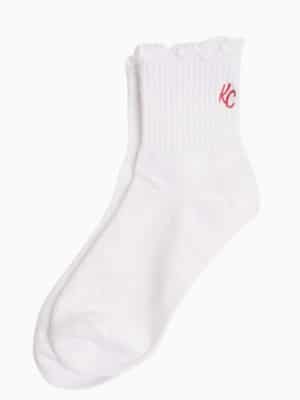 White ankle socks with delicate ruffled edge and embroidered red KC detail, designed for women’s shoe sizes 6–9.