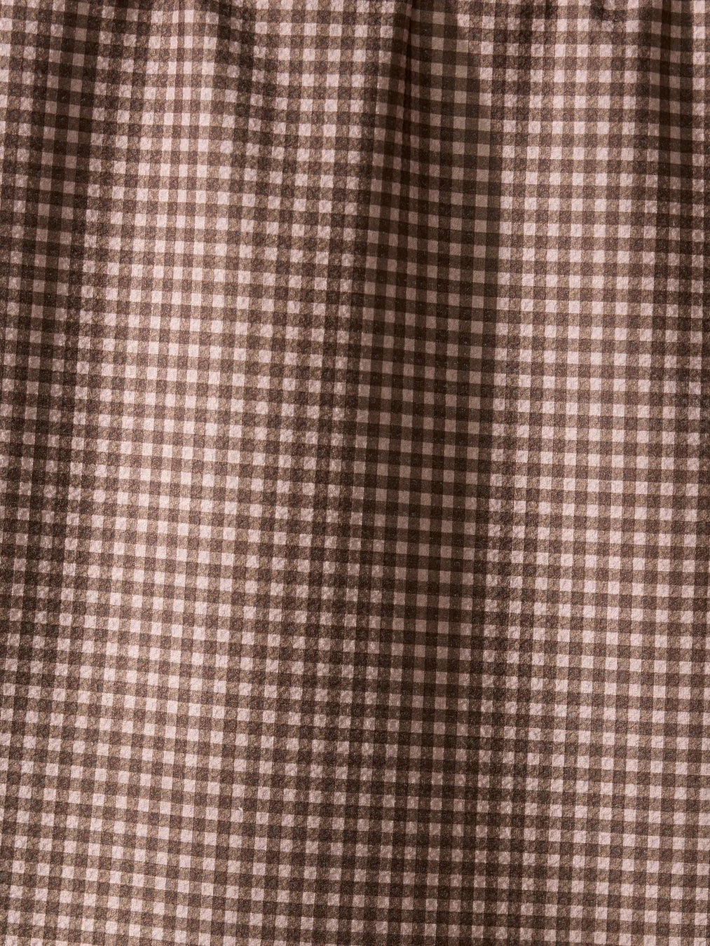 Close-up of Hearth Geometry Towel showing detailed brown and ivory check pattern on soft microfiber fabric.