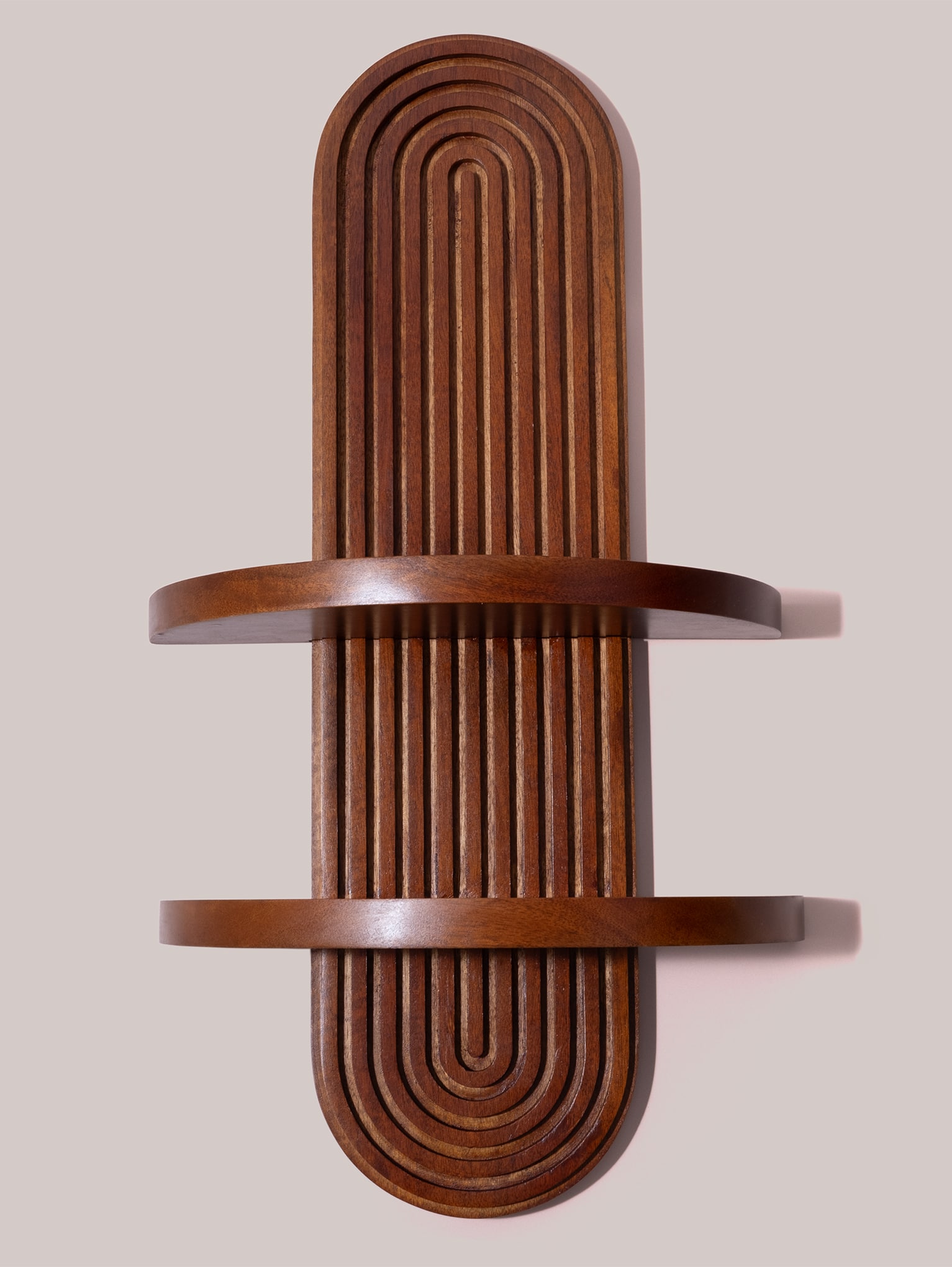 Studio view of the Arched Wood Wall Shelf showing full silhouette and two rounded display shelves.