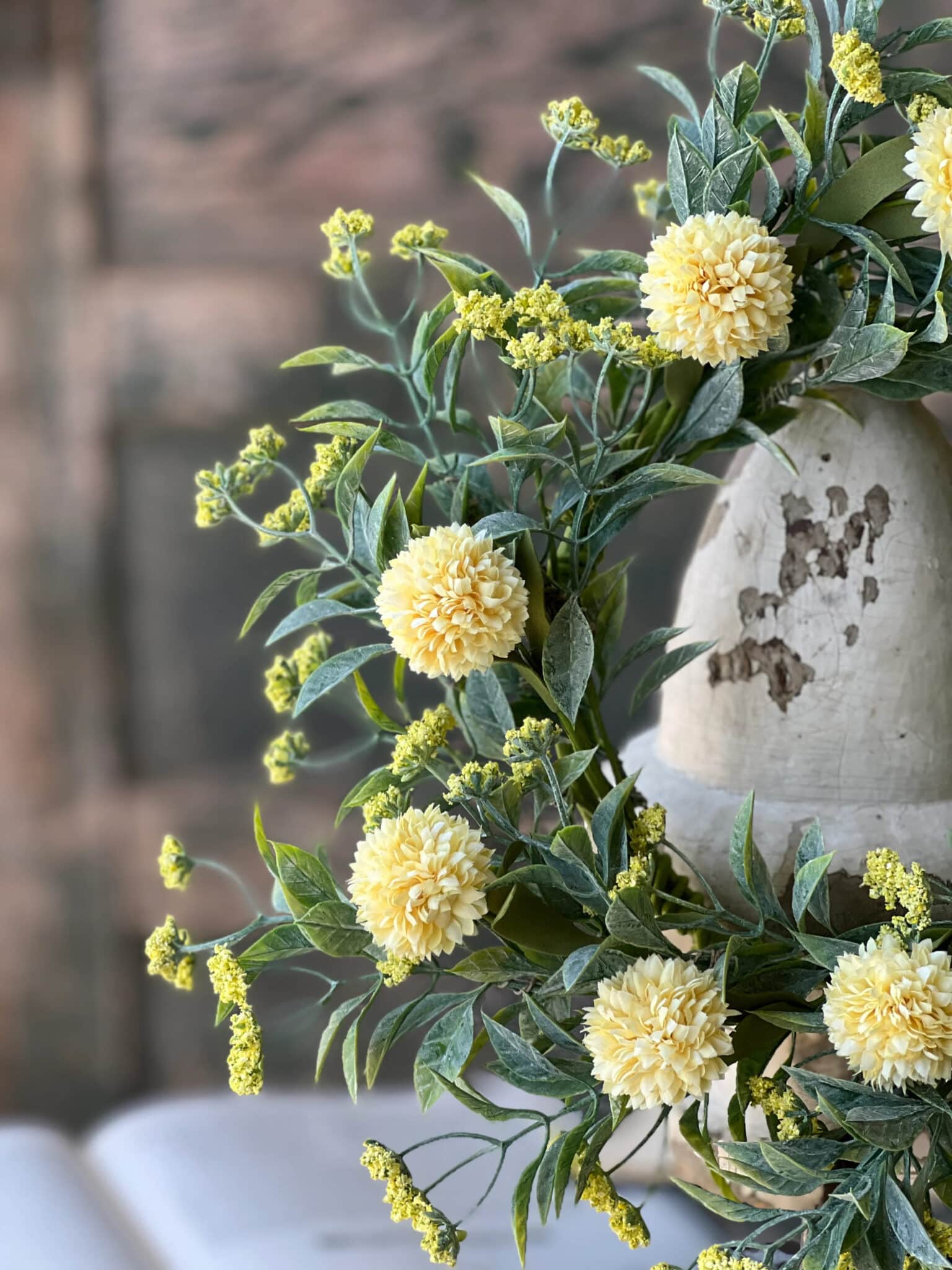 Yellow Garden Pom Candle Ring with soft yellow pom blooms and layere