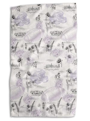 KSU Football Tea Towel with vintage-inspired Kansas State designs, wheat, florals, helmets, and landmarks, double-sided with purple plaid reverse, 18x30.