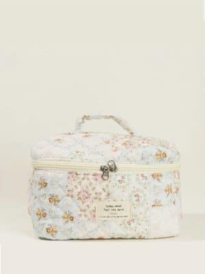 Quilted Floral Makeup Bag – Large in soft pastel patchwork print with top handle and zippered closure.